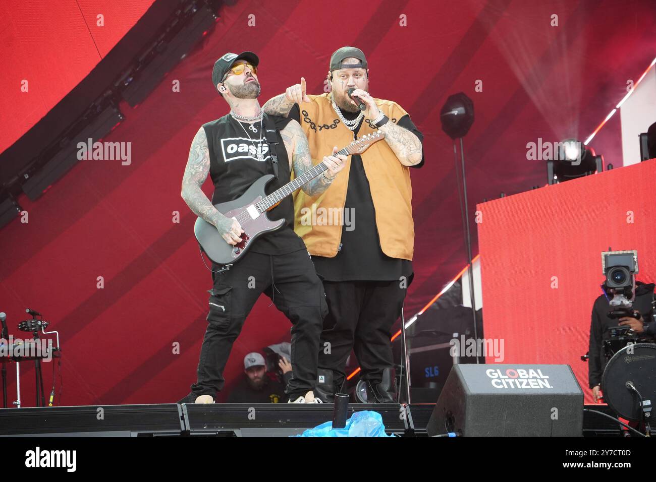 Jelly Roll performing energetically onstage at the Global Citizen