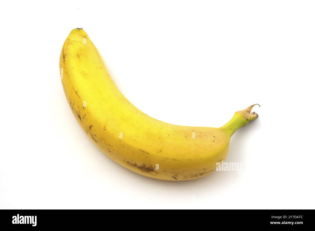 Banana with black spots isolated on white background. Overripe banana Stock Photo