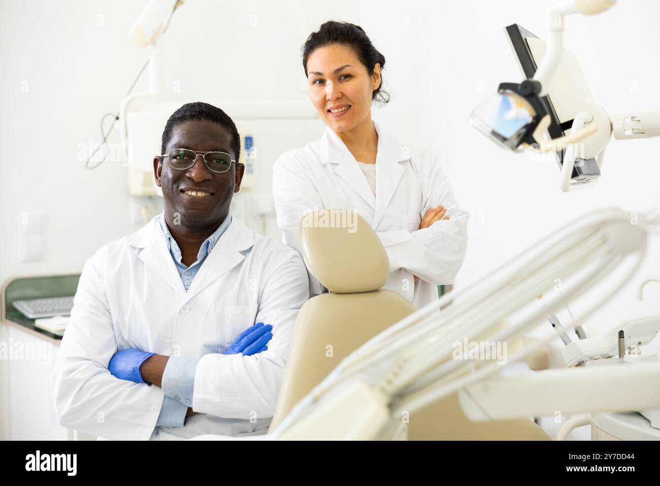 Two successful professional dentists in modern dental office Stock Photo