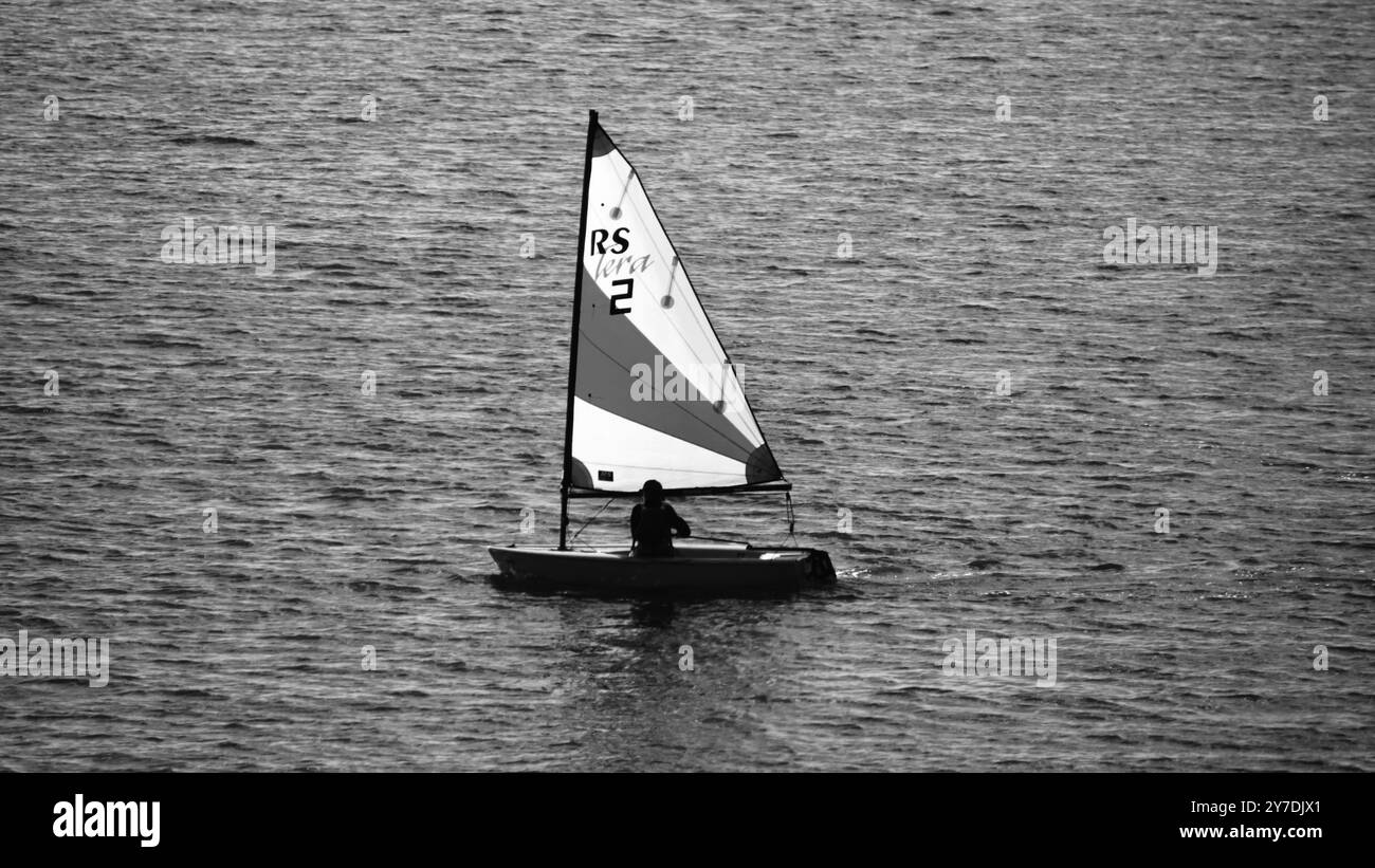 sunlit sailing Solcombe Cornwall Stock Photo