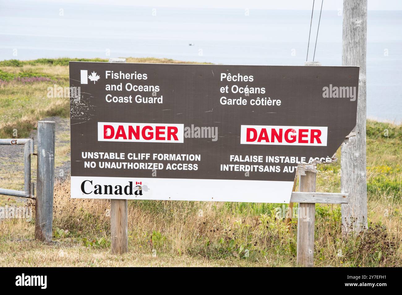 Fisheries and Oceans danger sign at Bell Island heritage lighthouse in Newfoundland & Labrador, Canada Stock Photo