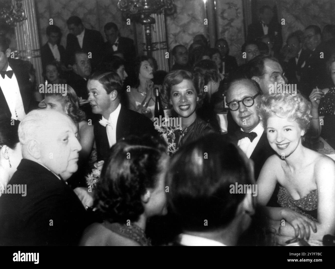 Cafe de Paris Party After The Royal Show 16th November 1950  After the Royal Command Variety Performance on Monday, a party was held for stars and guests at the Cafe de Paris.  Photo Shows:  Photographed at the party on Monday evening, left to right, facing camera, Sharman Douglas (almost hidden), the Marquess of Blandford (her escort), US singer Dinah Shore, comedian Jack Benny. Stock Photo