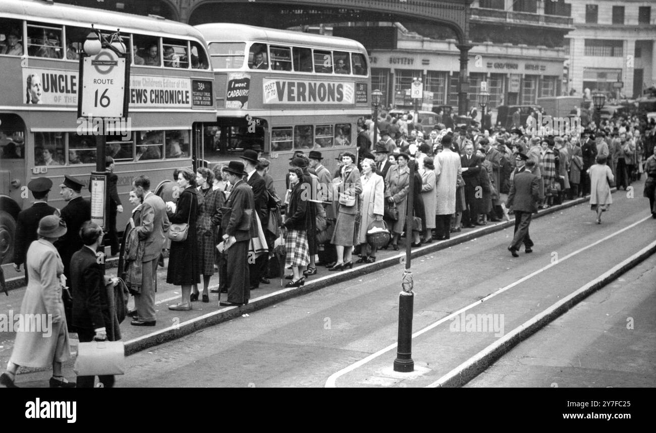 There are long queues - and just two buses - at Victoria Station terminal today (Friday) as London's bus strike became more serious.  Eleven thousand busmen are now out in support of the unofficial strike against further employment of women conductors and as protest against the union's refusal to claim for an extra £1 per week on wages. September 15th 1950 Stock Photo