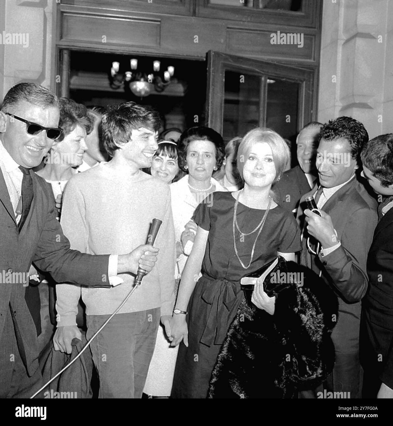 London fashion photographer 27 year old David Bailey wears a blue sweater and green corduroy slacks for his marriage this morning to 22 year old french star Catherine Deneuve former girl friend of Roger Vadim French director at St Pancras Register Office London 18 August 1965 Stock Photo