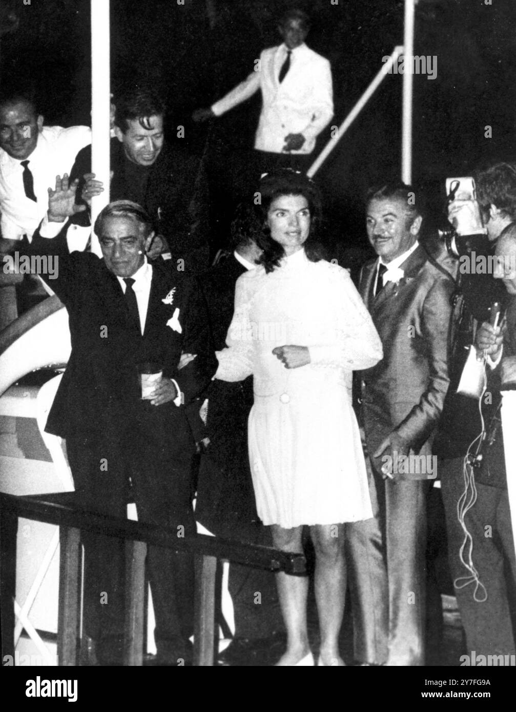 ''Here comes the bride '' Island of Scorpios, Greece:Mrs Jacqueline Kennedy, and Mr Aristotle Onassis, at the Champagne wedding reception held on board the yacht Christina here yesterday, after their wedding at the Chapel of Holy Virgin on Scorpios Island.  Mrs Kennedy, 30 Year old widow of President Kennedy, exchanged simple gold rings with Mr Onassis in a colourful Greek Orthodox ceremony at the chapel ceremony. 21 October 1968 Stock Photo