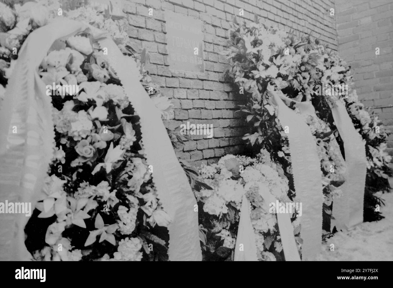 Flowers and wreaths decorate the side of the Kremlin Wall in Moscow. They were placed by leaders of the Communist Party of the Soviet Union and the Soviet Government on March 27th 1968, the eve of A.M. Gorky, the great prolitarain writer and founder of Soviet Literature, 100th Birthday anniversary. Stock Photo