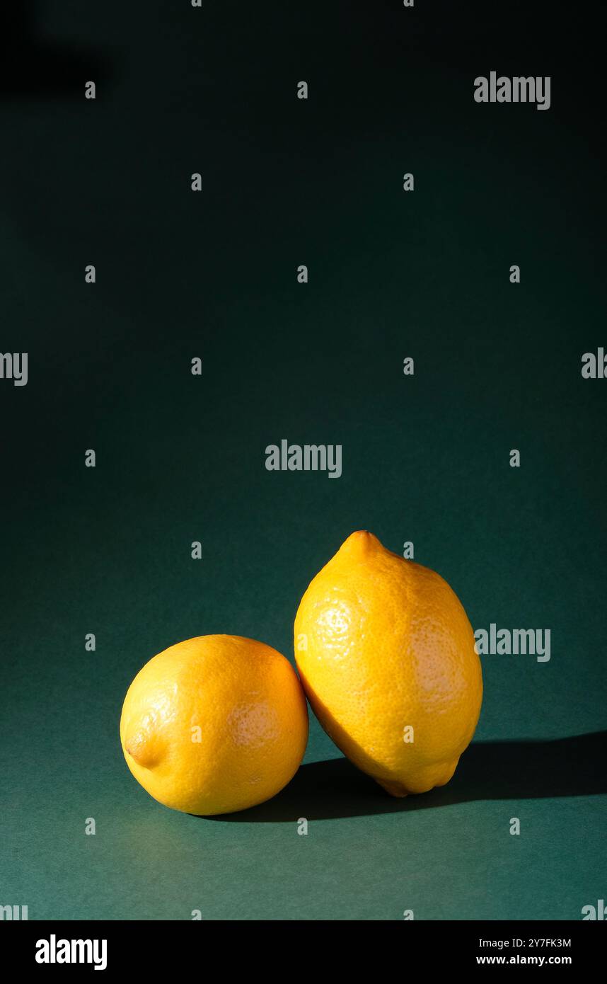 yellow lemons on green background Stock Photo