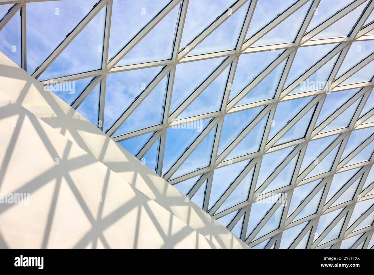 Lightning Layout Mall Glass roof of the mall inside view, with part of white concrete wall ...