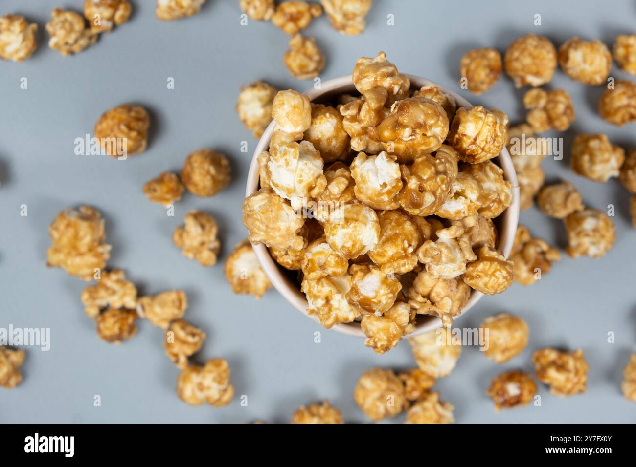 Sweet caramelized popcorn top view close up. Stock Photo