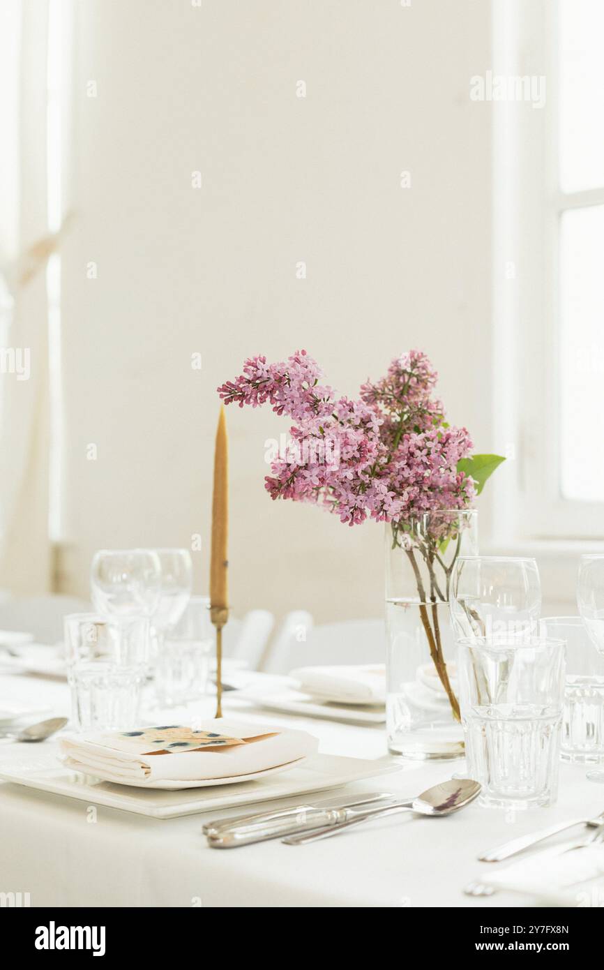 Spring wedding centre piece with purple lilacs Stock Photo