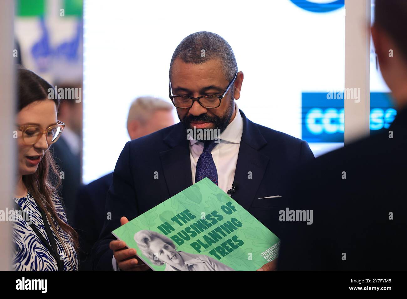 Birmingham, UK. 30th September 2024. Birmingham on Monday 30th September 2024. Birmingham on Monday 30th September 2024. Birmingham on Monday 30th September 2024. James Cleverly MP carrying a Maggie Thatcher placard at the Conservative Party Conference at the International Conference Centre, Birmingham on Monday 30th September 2024. (Photo Credit: Pat Scaasi | MI News) Credit: MI News & Sport /Alamy Live News Stock Photo