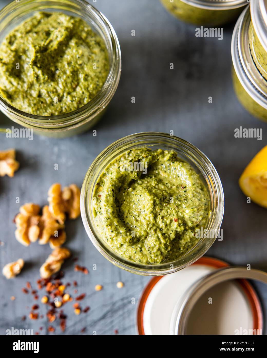 Fresh Homemade Basil Pesto in glass jars Stock Photo