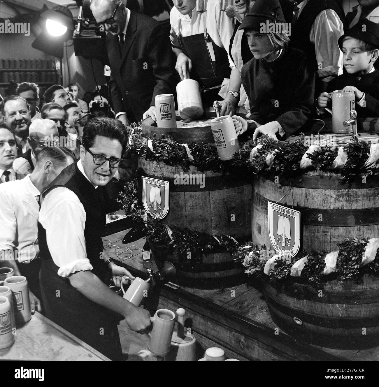 23 SEPTEMBER 1964  The Lord Mayor of Munich, Hans-Jochen Vogel, filling the first steins of this year's beer festival, Oktoberfest. Munich, Germany. Stock Photo