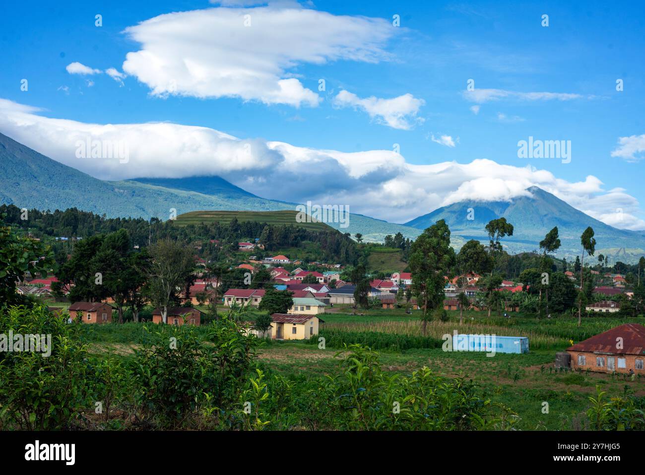 A village in Kisoro Uganda with Mt Muhavura in the background. Stock Photo
