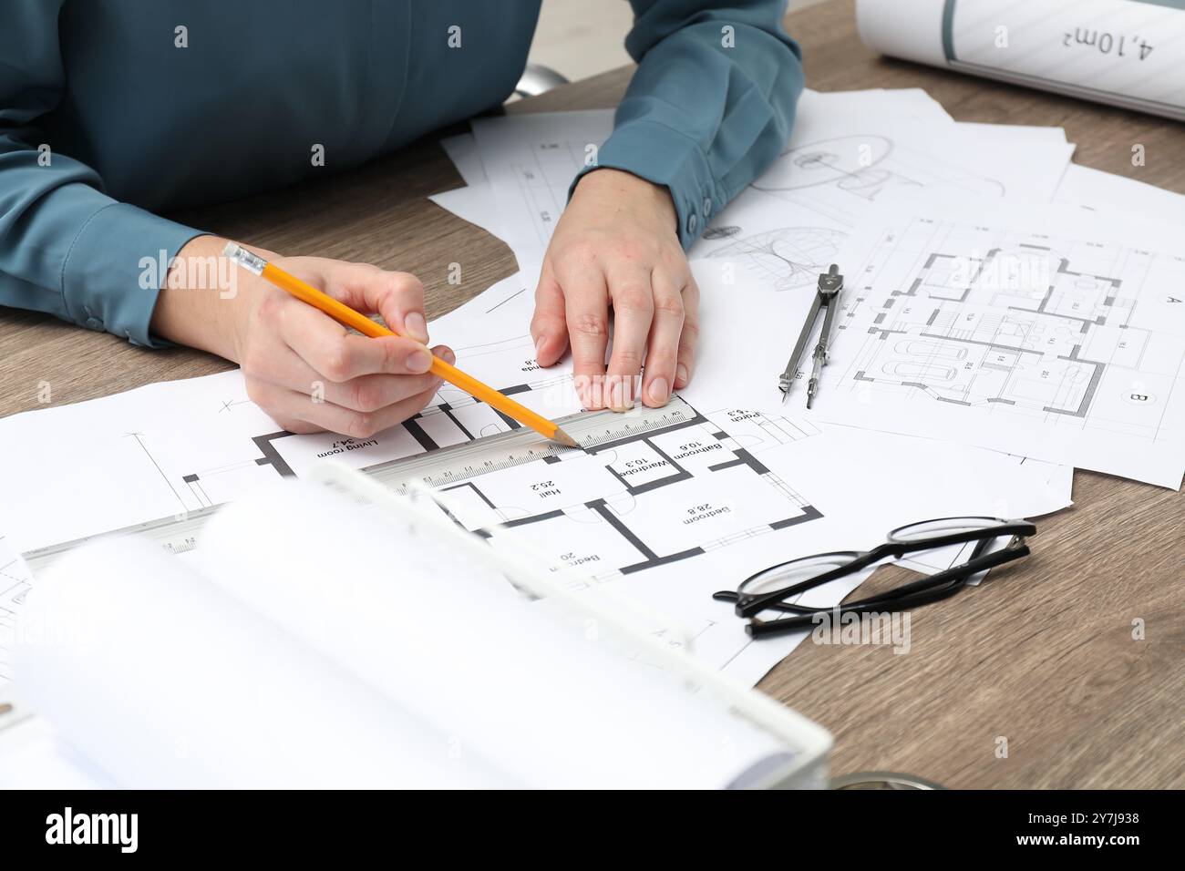 Architect working with project, closeup. Different technical drawings ...
