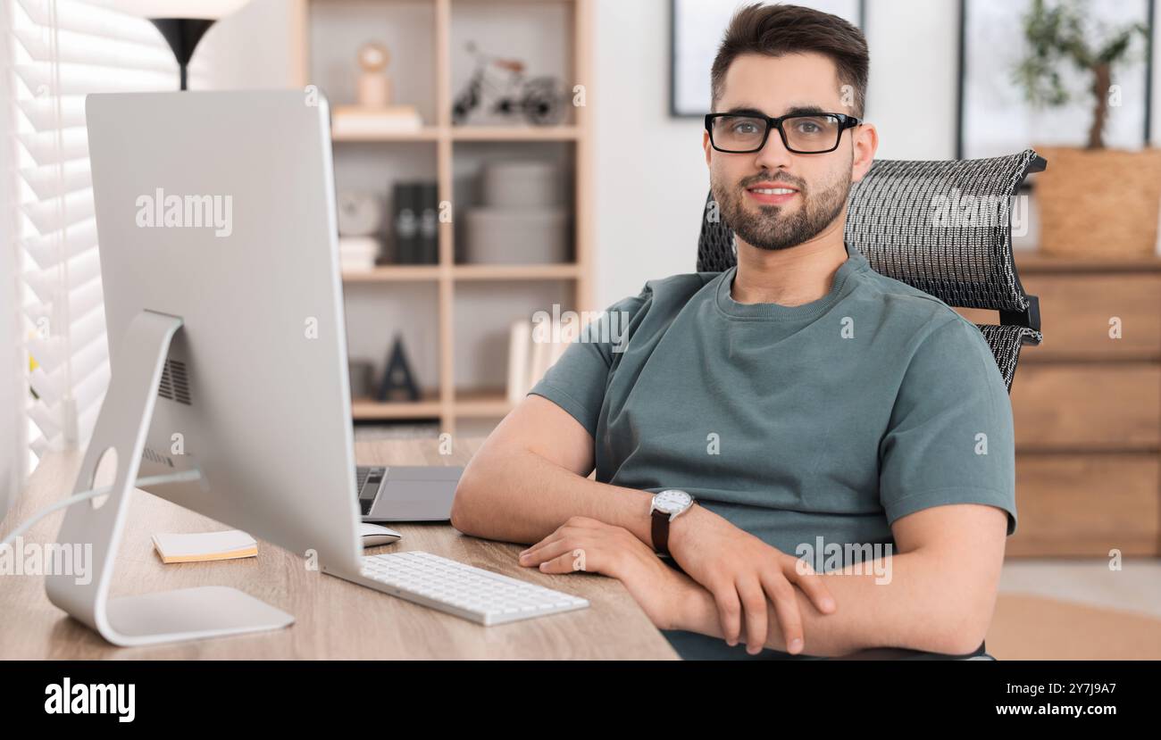 Programmer working at desk in office. Banner design Stock Photo - Alamy