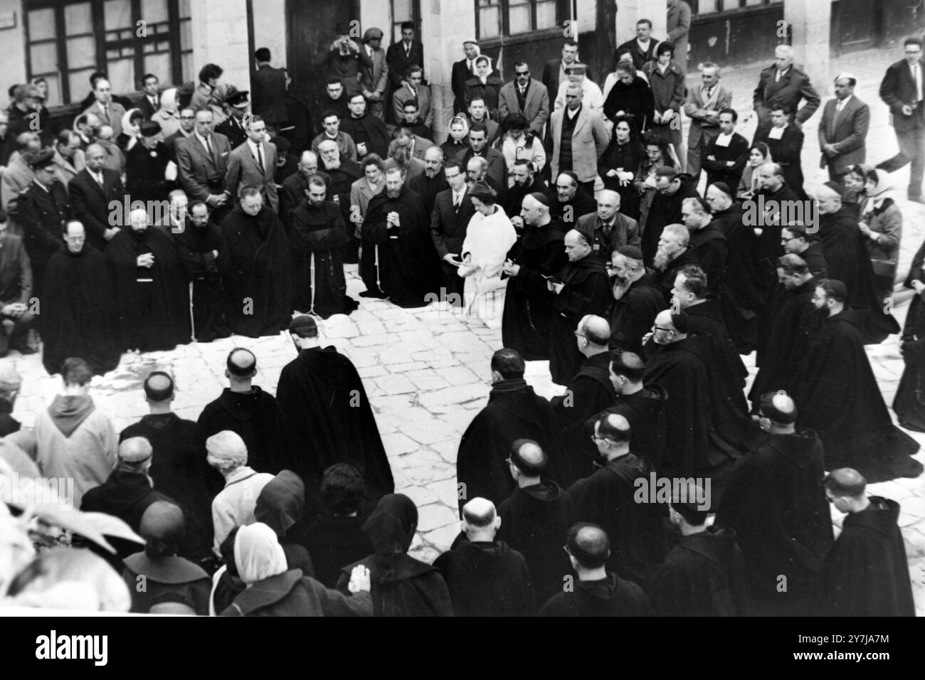 QUEEN FABIOLA AND KING BAUDOUIN KNEEL WITH GROUP OF PRIESTS IN ...