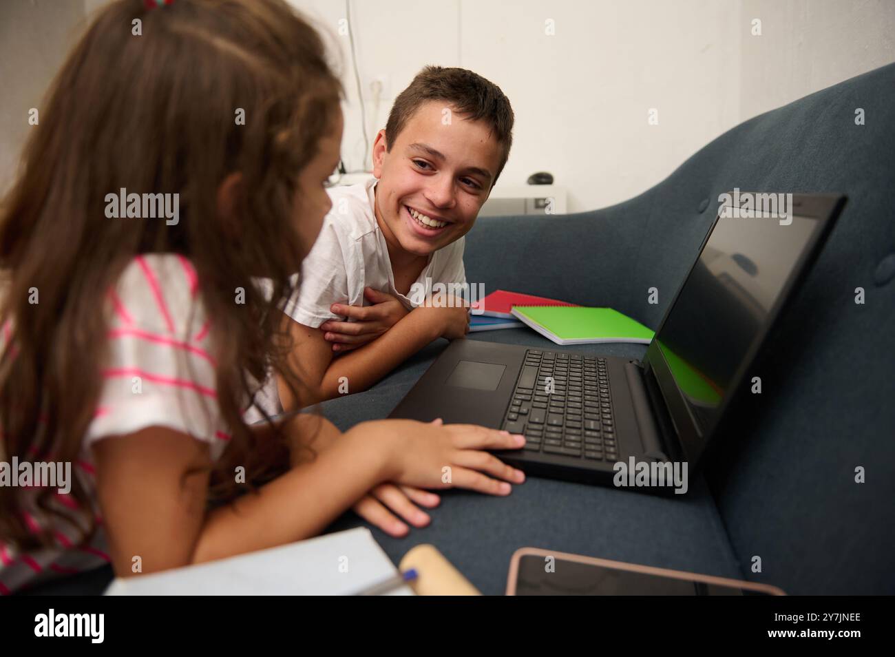 Sibling Learning Happy siblings studying together hi-res stock photography and images ...