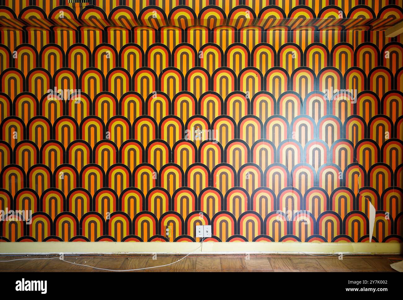 1970s retro wallpaper inside an abandoned home. This house has since been demolished. Stock Photo