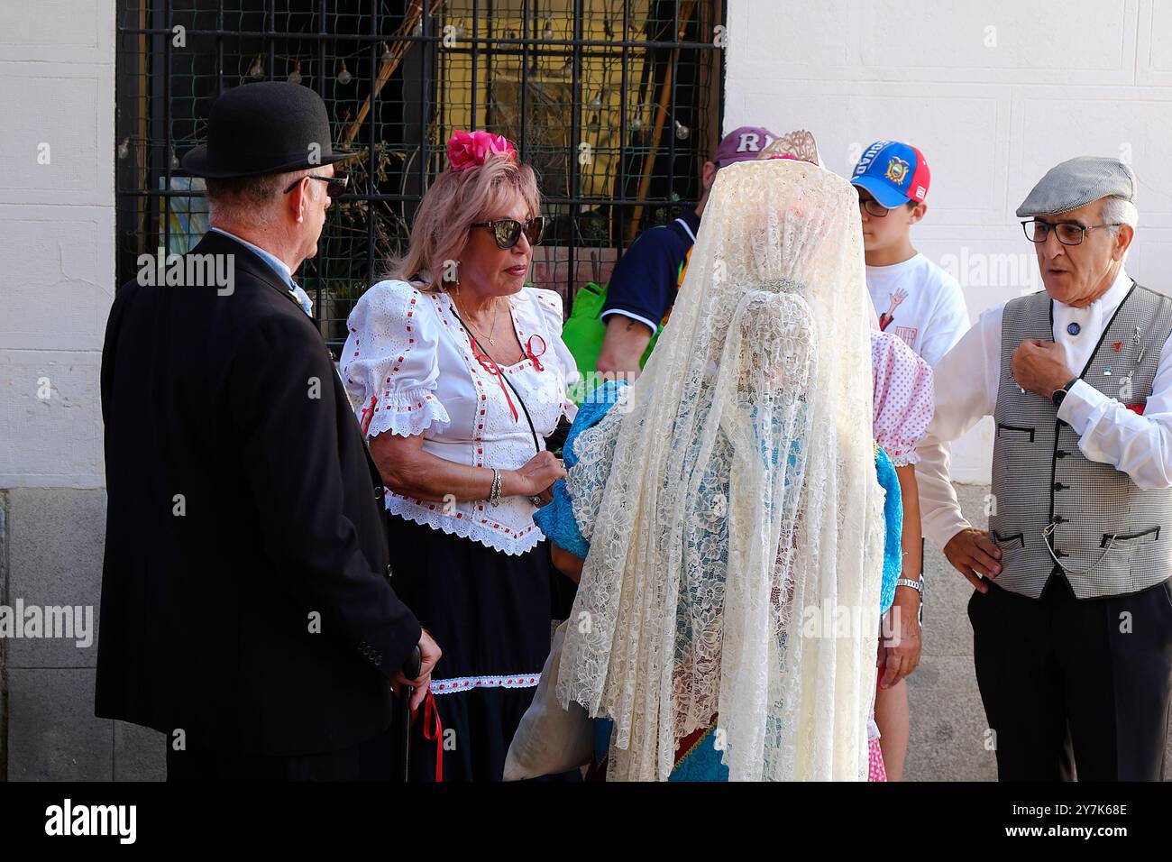 People in typical costumes at La Paloma feasts in Madrid. Stock Photo