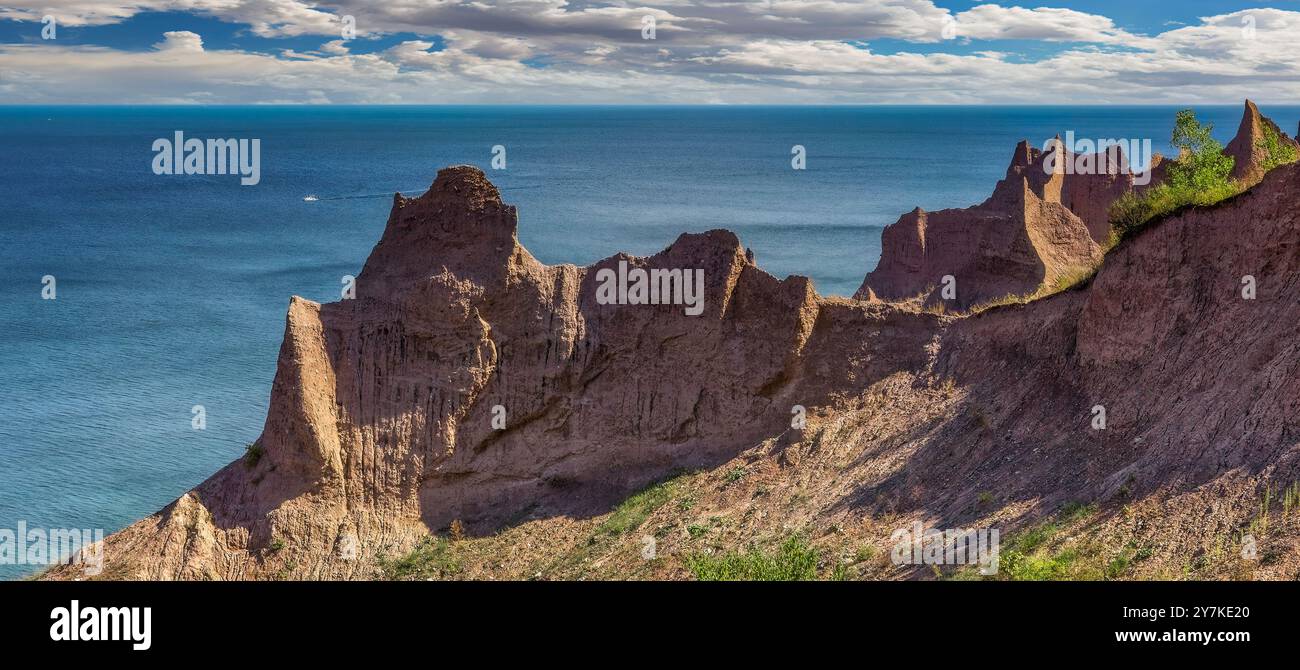 Chimney Bluffs State Park is a state park in the town of Huron in Wayne County, New York on Lake Ontario, on the eastern shore of Sodus Bay. The Bluff Stock Photo