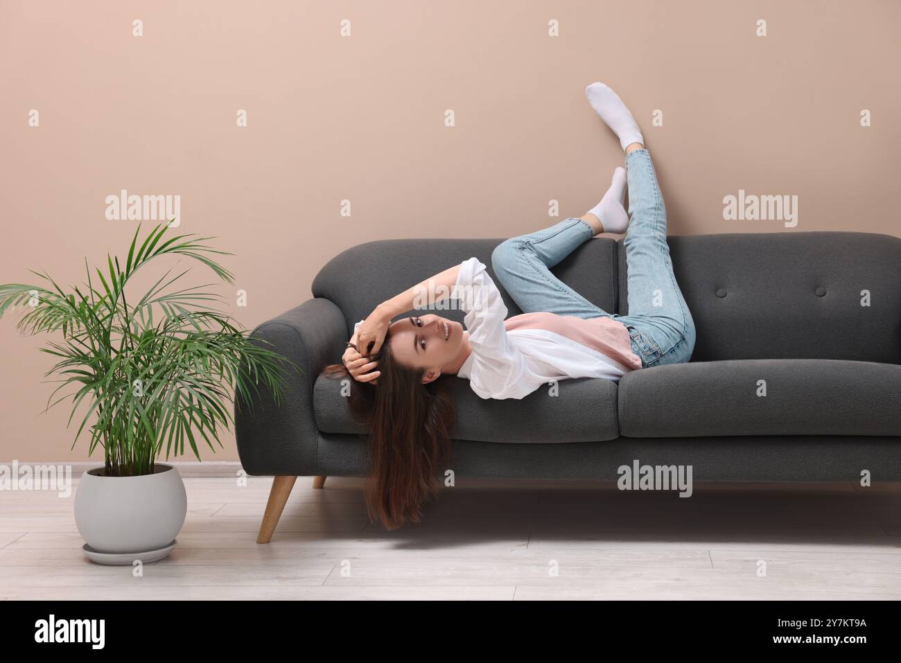 Woman posing on sofa hi-res stock photography and images - Alamy