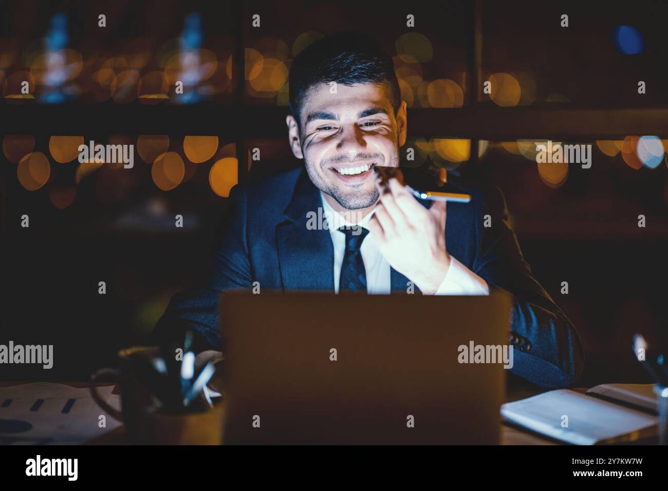 Office Manager Guy Using Voice Assistant On Smartphone In Office Stock Photo