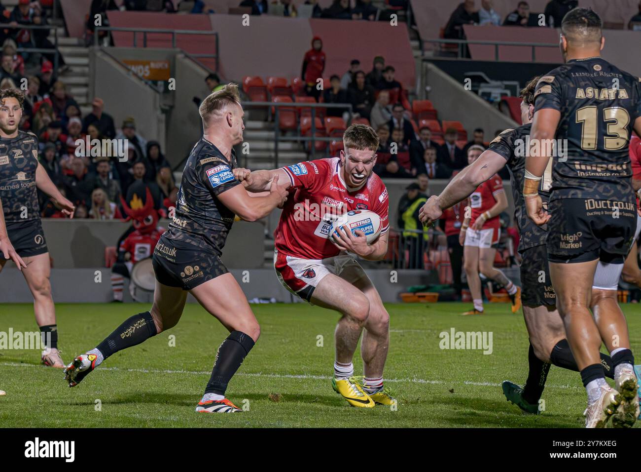 Loghan Lewis takes a tackle for Salford Red Devils in the Super League play-off v Leigh at the Salford Community Stadium, Salford, UK, 27.09.2024 Stock Photo