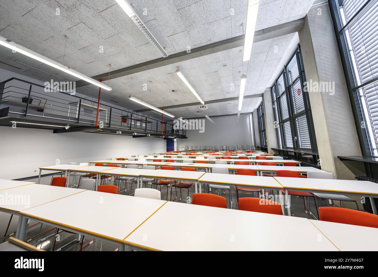 Classroom with modern furnishings, white tables and orange-coloured chairs, University of Stuttgart, Germany, Europe Stock Photo