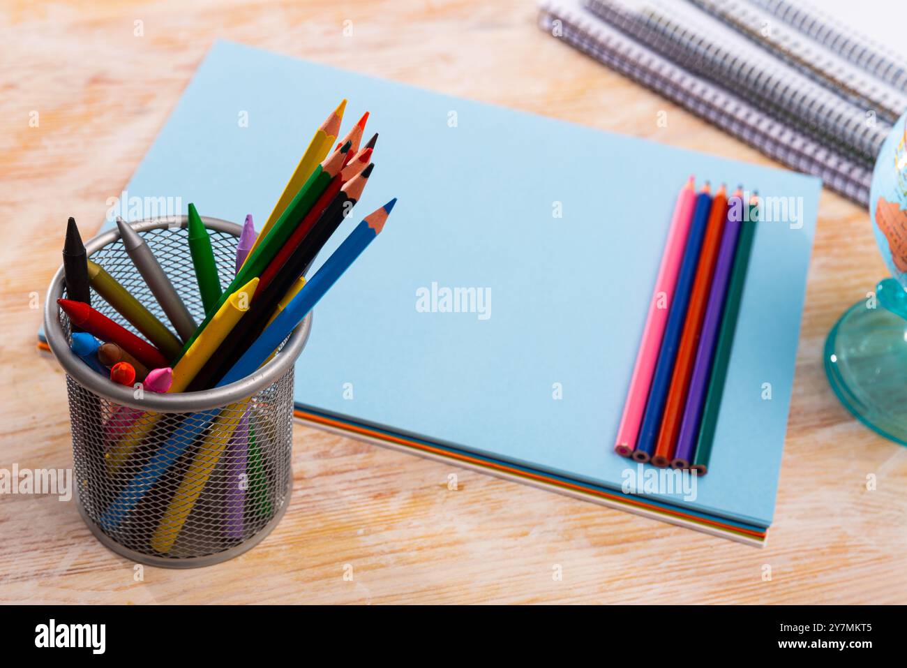 Colored pencils kept in pencil holder Stock Photo