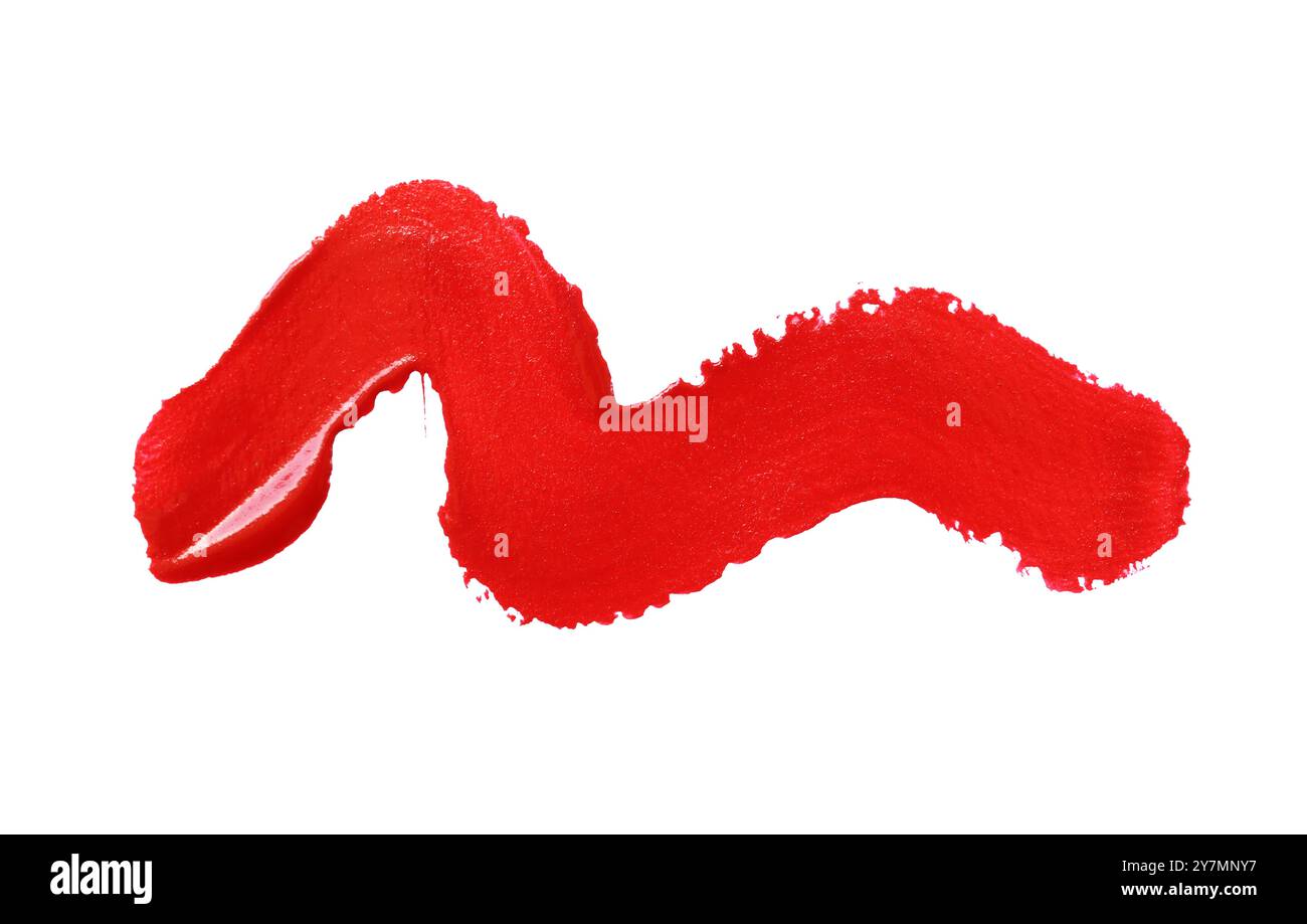 Close up vibrant red paint stroke set against isolated on white ...