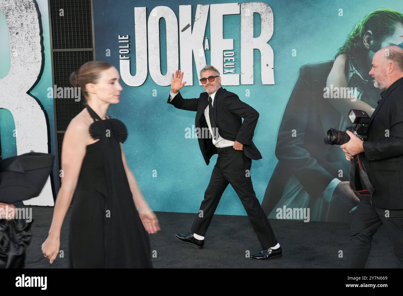 Rooney Mara, left, and Joaquin Phoenix arrive at the premiere of "Joker