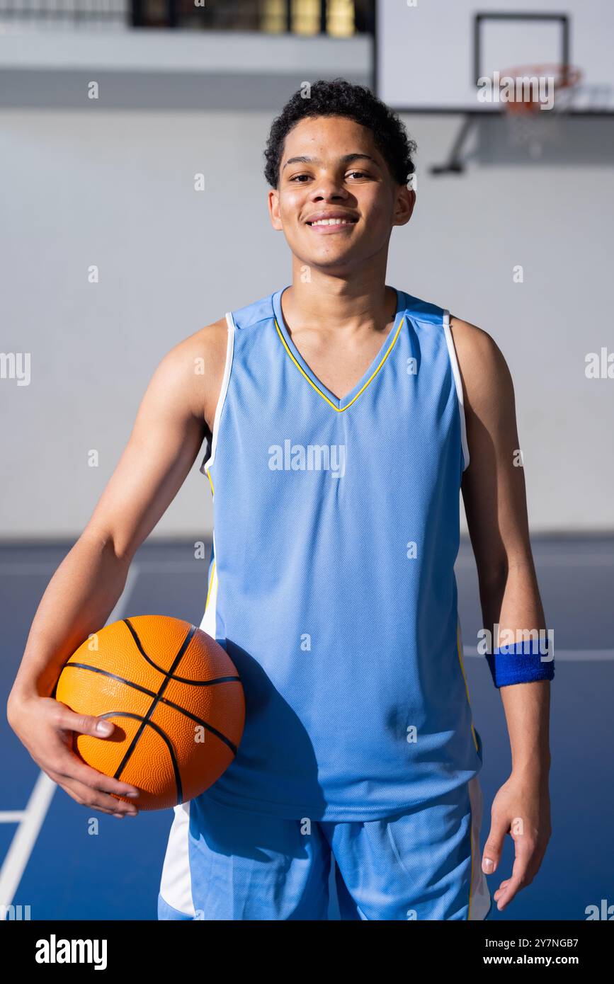 Boy standing on basketball court hi-res stock photography and images ...