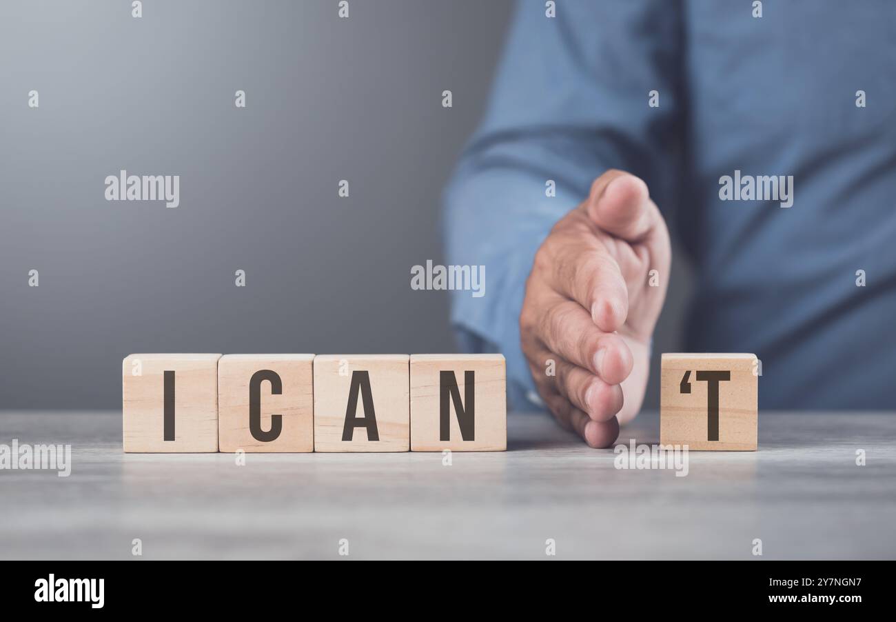 A hand separates the letter 