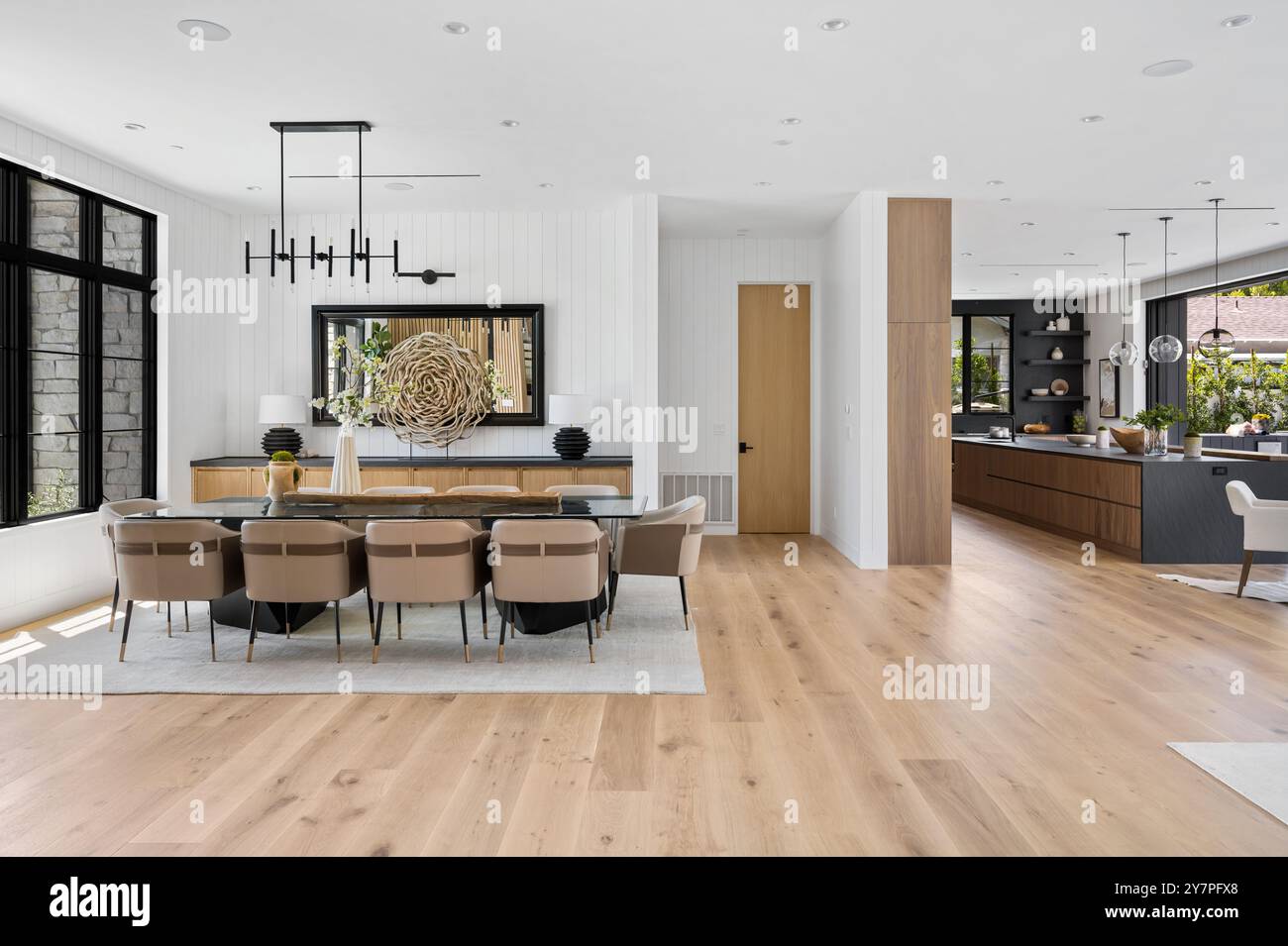 Modern open-plan dining and kitchen area with contemporary furnishings ...