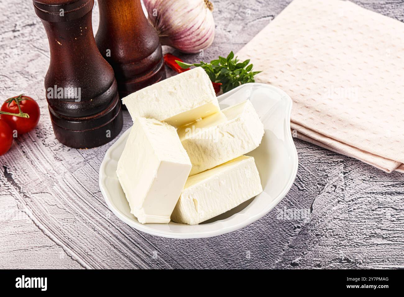 Greek traditional cuisine - Feta cheese bricks Stock Photo - Alamy