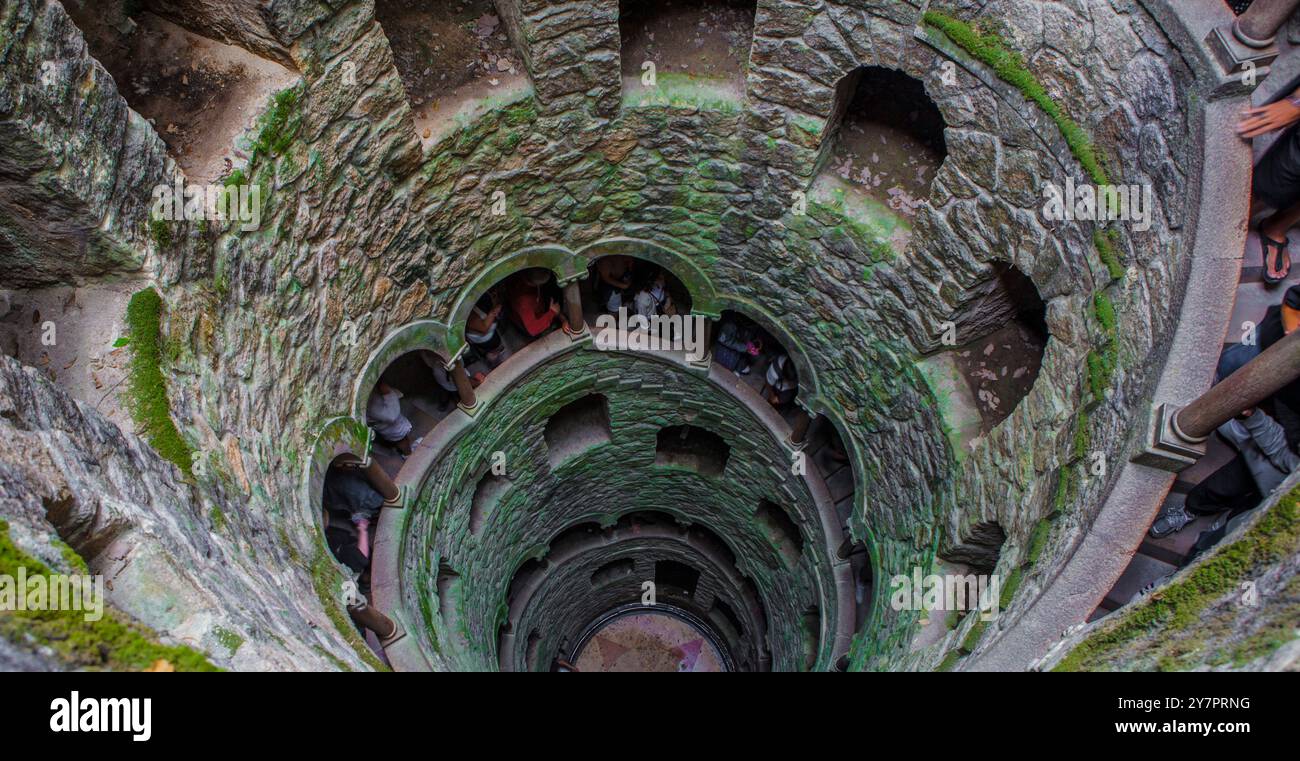 Sintra, Portugal, Aug 8th, 2024: Quinta da Regaleira, one of the principal tourist attractions of Sintra. Initiation Well Stock Photo