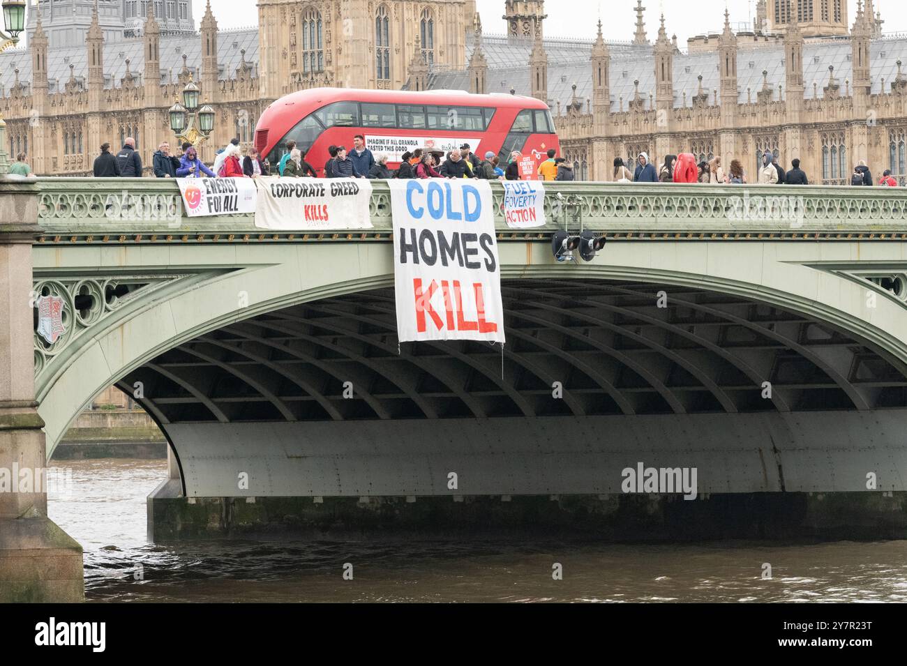 London, UK. 1 October, 2024. Fuel poverty campaigners perform a 