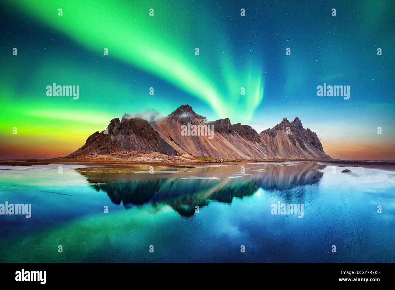 Aurora Borealis Northern Lights Over Famous Stokksnes Mountains On 