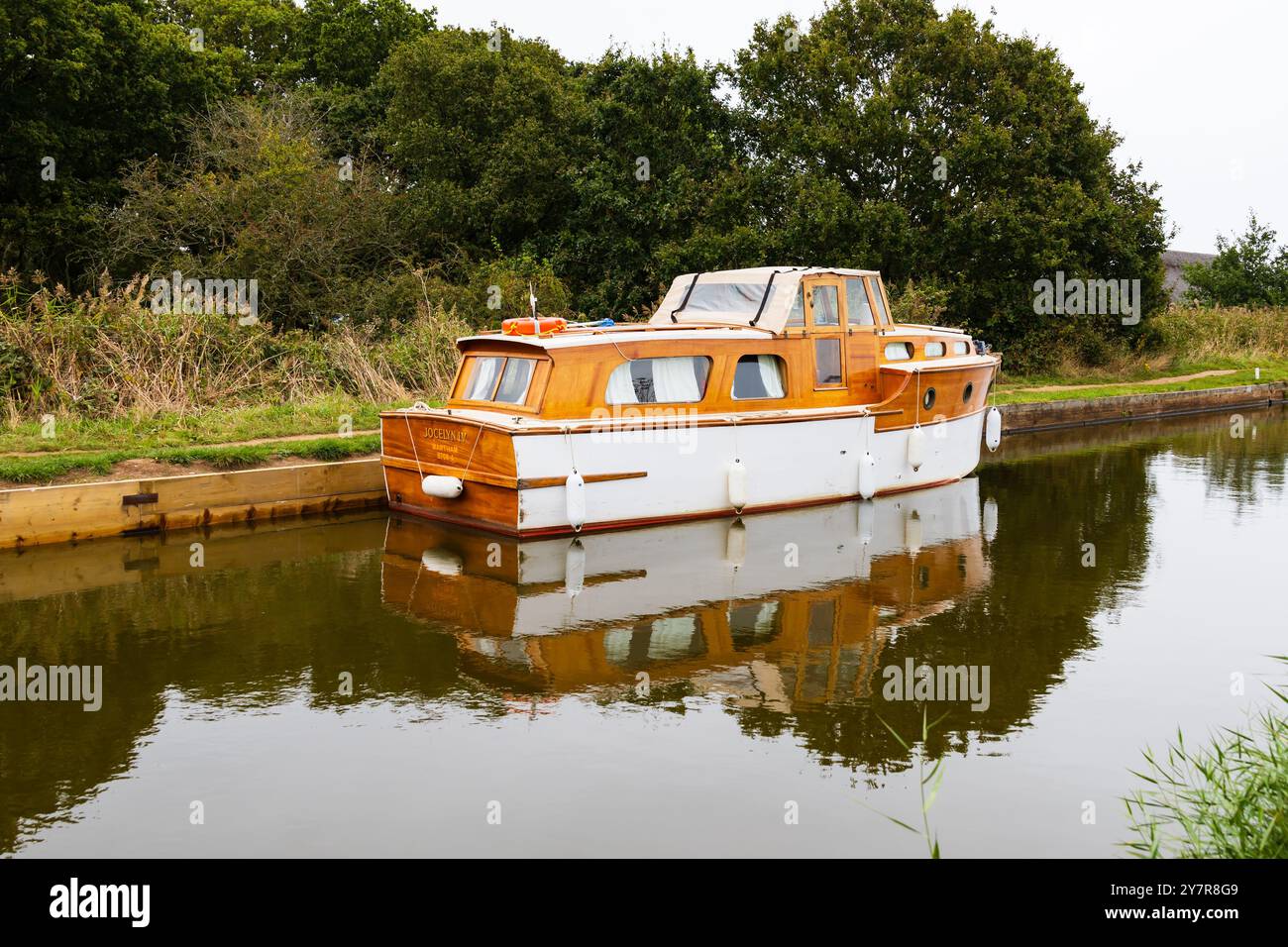 Wooden, traditional Norfolk broads cruiser boat moored. Horsey, Norfolk, England Stock Photo