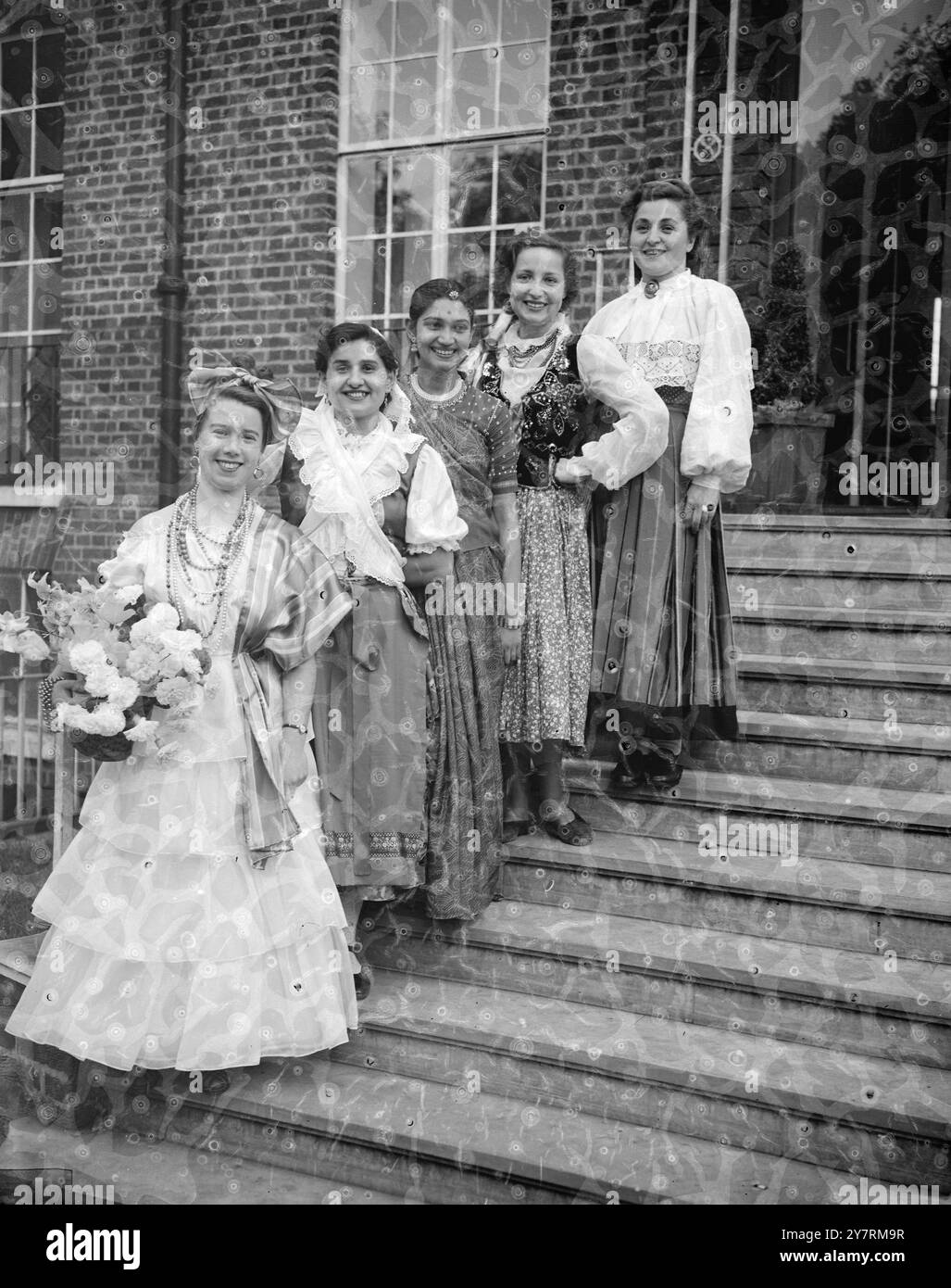 BEAUTIES OF FOREIGN LANDS.. 11.10.53. A rehearsal was held this afternoon at Cecil Sharp House, for the International Folk Dance Festival which will be held at the Royal Albert Hall, October 16th and 17th. Dancers from 25 different countries will perform. I.N.P. PHOTO SHOWS: Some of the international beauties represented at the show are here L to R; top to bottom of the steps; Aili Eistrat (Estonia), Danuta Mikosza (Poland), Tarla Gandhi (Bombay, India), Maria Kiss (Budapest, Hungary), and Lucia Penteado (Sao Paulo, Brazil). Picture by Joe Waldorf / INTERNATIONAL NEWS PHOTOS. Stock Photo