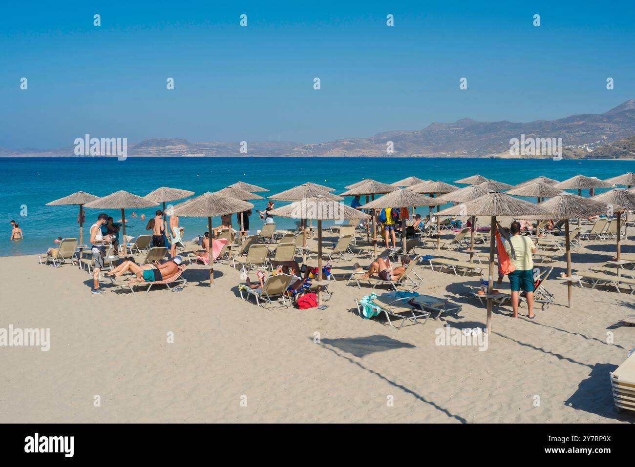 Sitia Beach, view in summer of people sunbathing on the beach in Sitia Bay, Crete, Greece, Europe Stock Photo