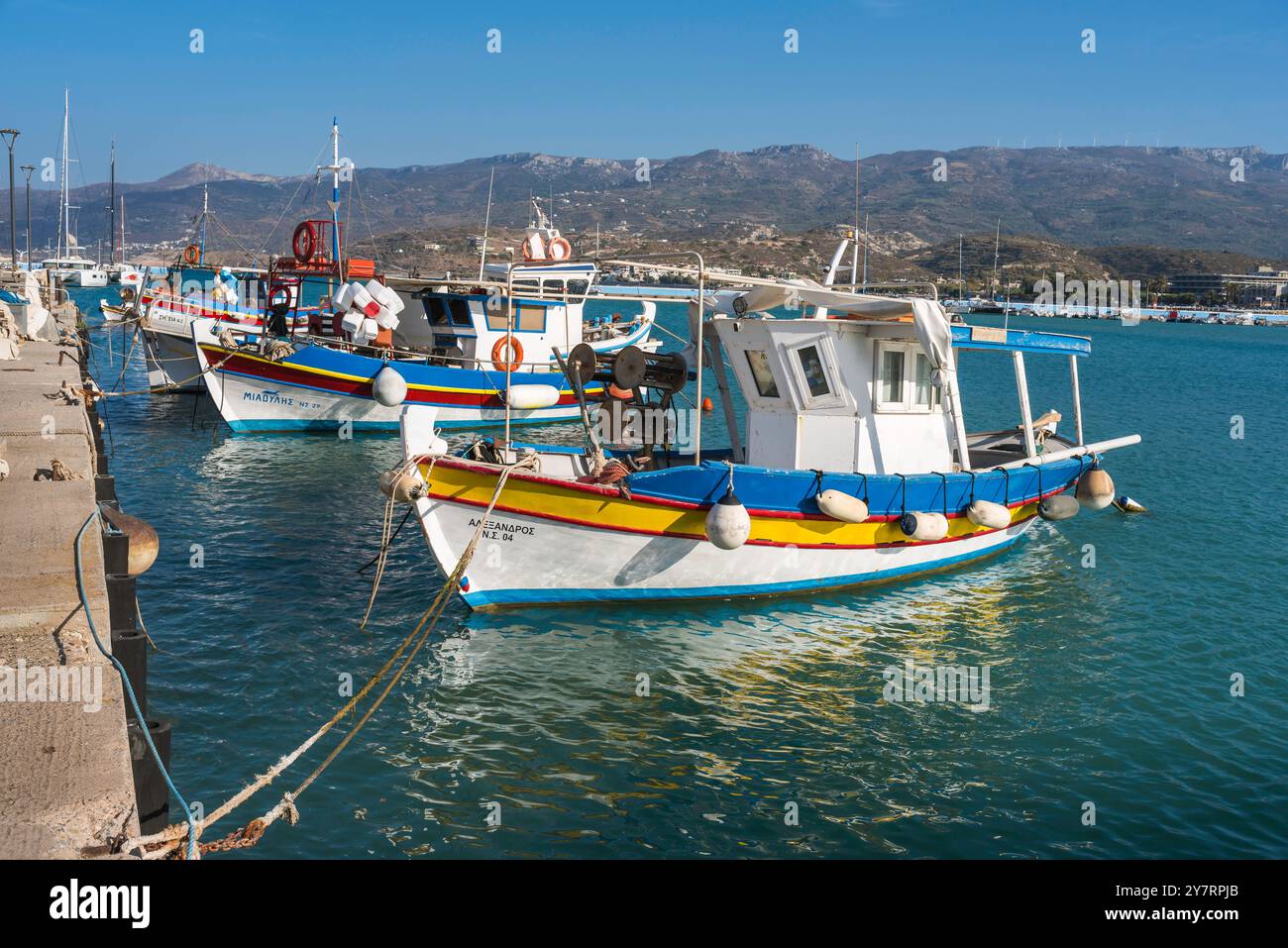 Crete fishing boat, view of colourful Greek fishing boats moored in Sitia Bay on the north-east coast of Crete, Greece. Stock Photo