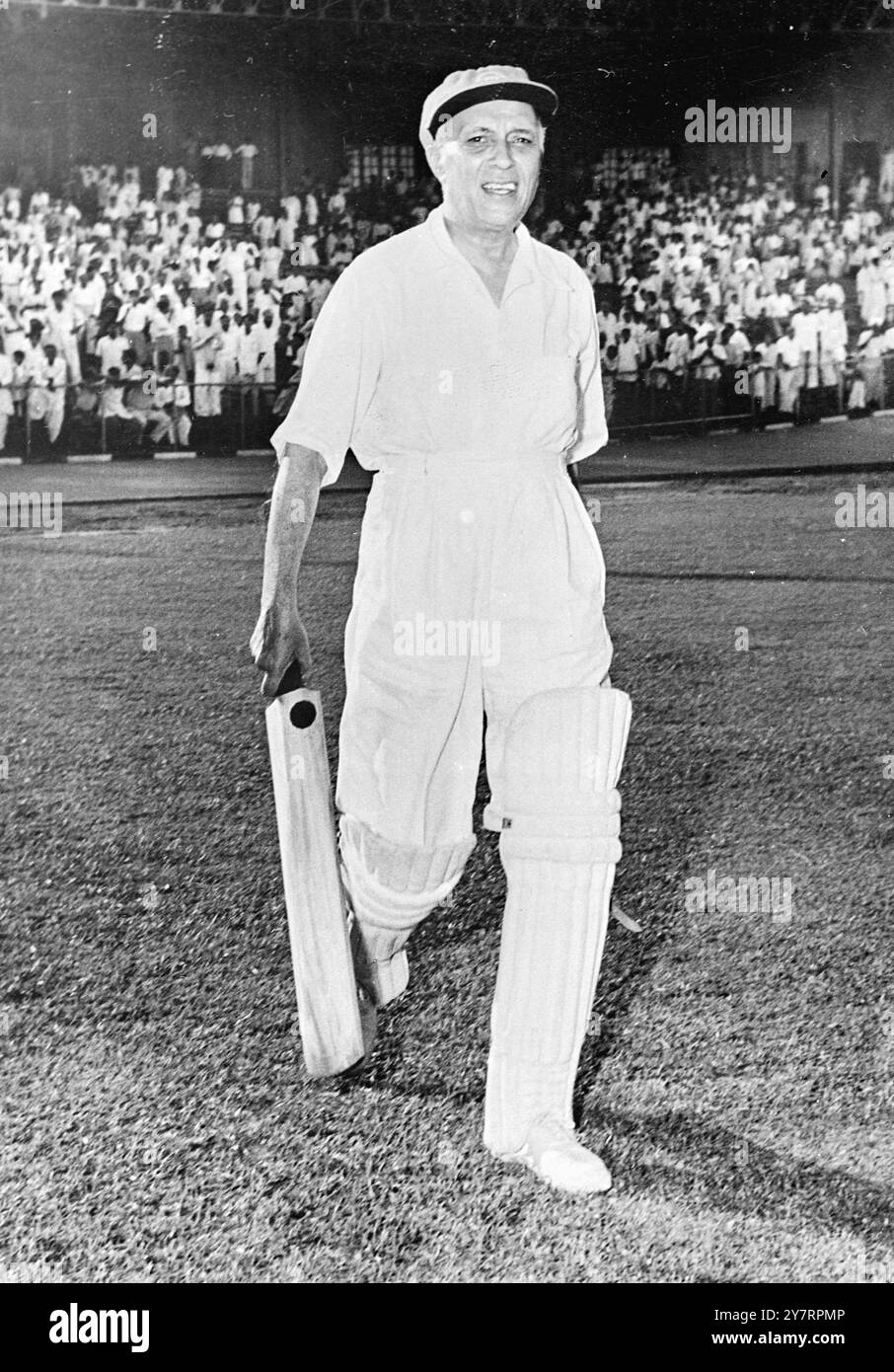 MR NEHRU AS CRICKET CAPTAIN. - I7.9.53. - Mr Pandit Nehru, Prime Minister of India, captained - a cricket team drawn from members of the House - 20 - of the People against a team captained by Sir - Sarvepalli Radhakrishnan, Vice President of India, - drawn from members of the House of States. The mtach - was played in aid of charity for the relief fund for - Flood victims. The match took place in New Delhi. - I.N.P. PHOTO SHOWS. - Mr Pandit Nehru all smiles - photographed as he went out to - bat he scored two runs then declared - I36.Special.H. - INTERNATIONAL NEWS PHOTOS. - 71152. Stock Photo