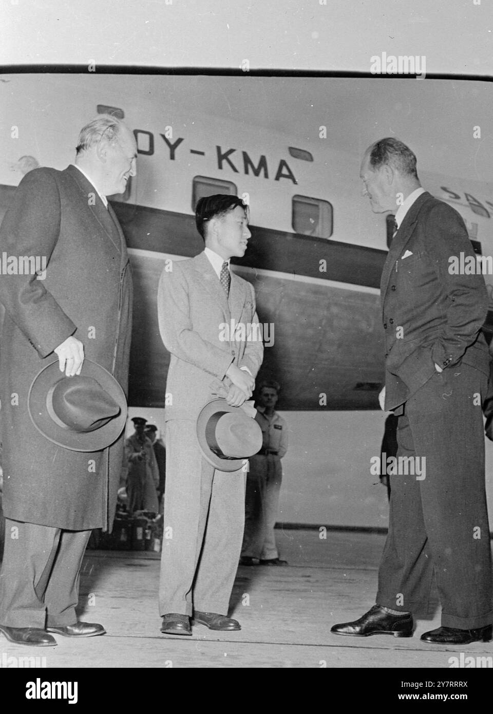 JAPANESE CROWN PRINCE VISITS DENMARK  6.8.53Crown Prince Akihito of Japan arrived yesterday in Copenhagen. He was met at the airport by Prince Axel of Denmark and the Danish Foreign Minister. Photo shows Watched by Danish Foreign Minister Old Bjorn Kraf (left) the two princes chat at Kastrup airport. Centre: Crown Prince Akihito of Japan; and right Prince Axel of Denmark. 6 August 1953 Stock Photo