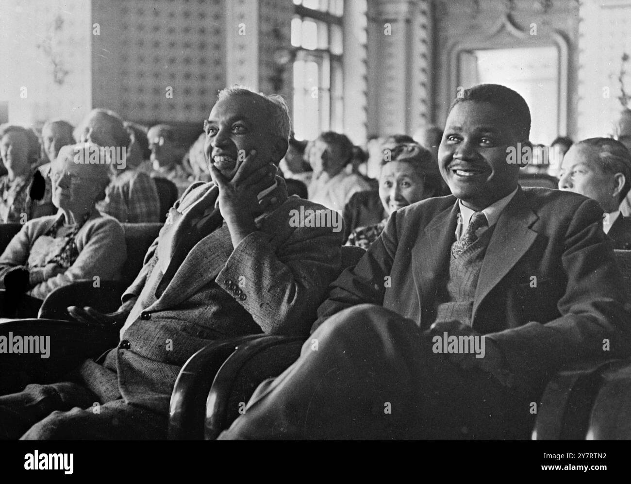 MORAL RE-ARMAMENT WORLD ASSEMBLY 15.7.53. Photo shows Attending a session of the Moral Re-Armament World Assembly at Caux, Switzerland, are (left) Mr. N. Keshavaiengar, Member of the House of the People in New Delhi for Bangalore and President of the Indian National Trade Union Congress of Mysore, and (right) Mr. Joshua Nkomo President of the Southern Rhodesian African Congress and Secretary of the Southern Rhodesian Railway Workers' Union.  15 July 1953 Stock Photo