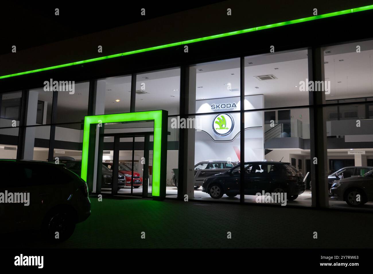 HAVIROV, CZECH REPUBLIC - NOVEMBER 2, 2018: Dealership of a Czech Skoda Auto brand in Havirov in evening hours with a green lightened entrance. Stock Photo