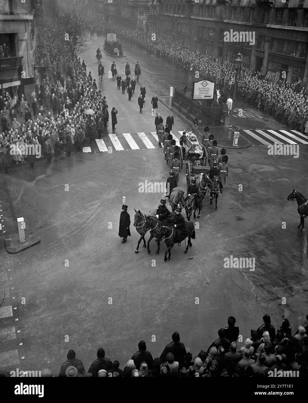 KING GEORGE VI ‘S CORTEGE ON THE WAY TO WESTMINSTER HALL          -11-2-52   PHOTO SHOWS:- The King's coffin seen in the procession as it leaves the Kingsway and enters Aldwych on the way from King's Cross Station to Westminster Hall for the Lying-in State today. Following the coffin are the Dukes of Edinburgh and Gloucester. On the coffin are the Imperial State Crown, worn by all reigning monarchs on all state occasions other than the coronation, and the Orb and Sceptre. The Orb symbolises the world dominated by Christianity . The Sceptre, with the Cross of St. George set on  it in rubies, is Stock Photo