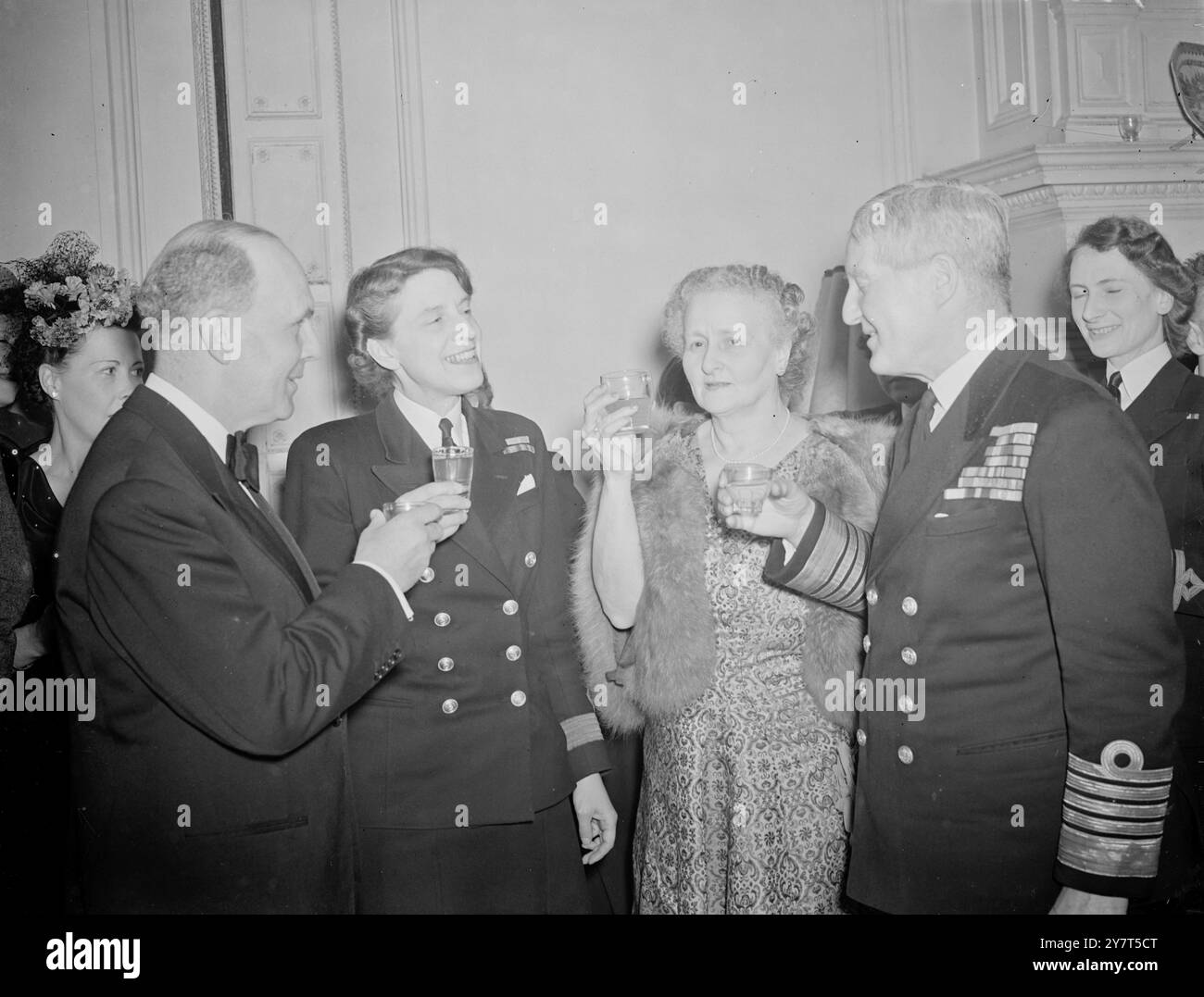 A W,R,N,S, OCCASION    Members of the Board of the Admiralty were among the guests when officers of the Admiralty Staff celebrated the inauguration of the permanent W.R.N.S. this evening at 4 , Princes Gardens , South Kensington , London .   The function also marked the completion of ten years since the Service was revived at the beginning of World War 11 .     PICTURE SHOWS :- Toast to the W.R.N.S. - Left to right ; Second Sea Lord Sir Cecil Harcourt , Miss J.M. Woollcombe , Director of W.R.N.S., Lady Harcourt and the First Sea Lord , Lord Fraser of North Cape , raise their glasses in toast t Stock Photo