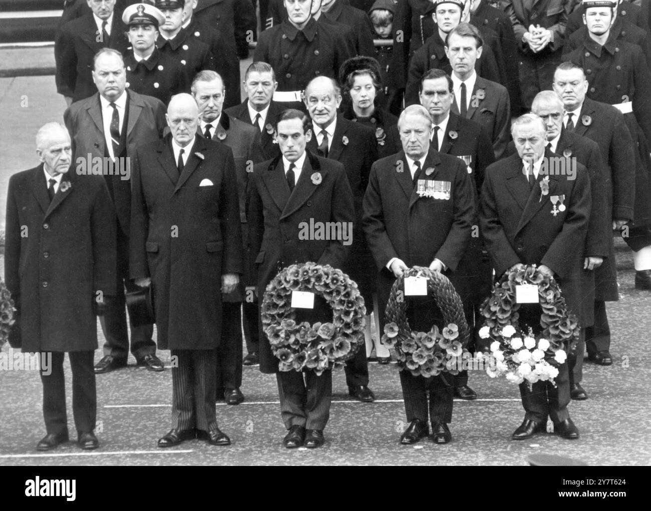 Britian's Prime Minister Harold Wilson (right), Opposition Leader Ted Heath and Liberal Leader Jeremy Thorpe (third from right) holding wreaths which they later placed on the base of the Cenotaph War Memorial in Whitehall this morning, when Her Majesty the Queen led Britain's homage to the dead of two World Wars in Remebrance Day ceremonies. Standing beside Mr Thorpe is Lord Gardiner the Lord Chancellor. Behind the Party leaders are (from left) Mr Michael Stewart, Defence Minister Denis Healey, Education Minister Patrick Gordon Walker, Minister of Housing Anthony Greenwood. In the third row ar Stock Photo